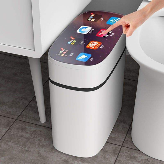 White plastic trash can with curved lid and colorful graphic top; hand on lid