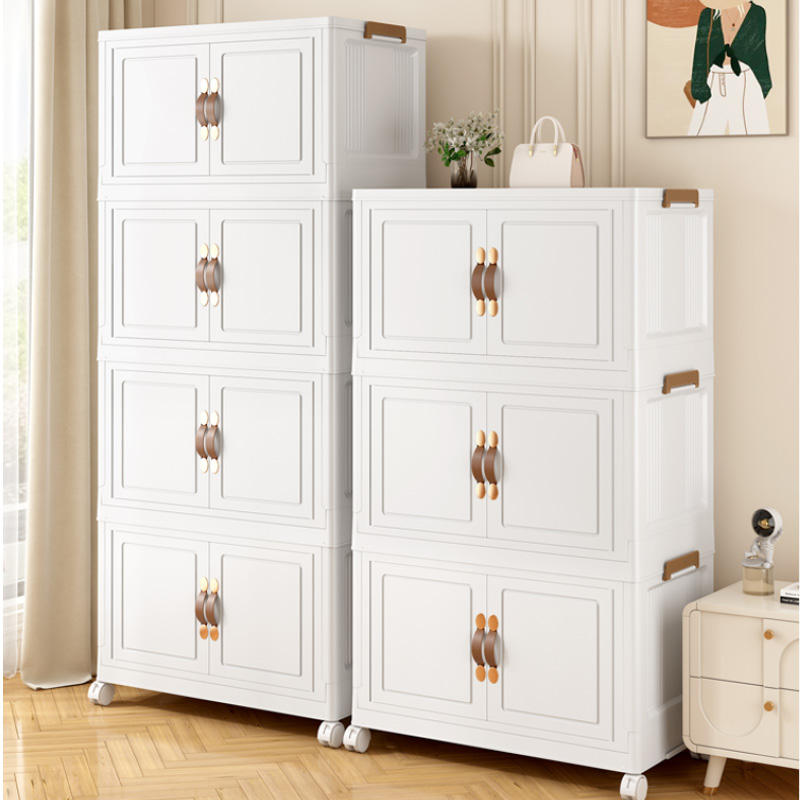 White foldable storage cabinet with double doors, gold knob pulls, and caster wheels