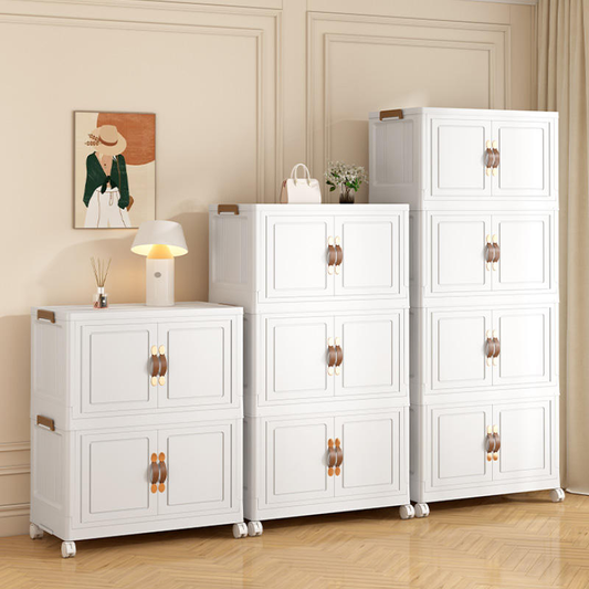 White storage cabinet with four-door layout, gold pulls, and caster wheels